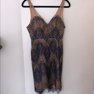 Nude dress with blue lace overlay